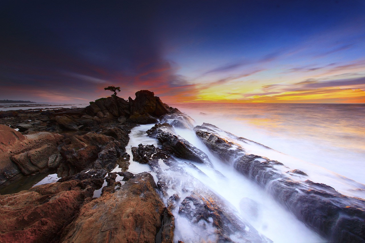 coast sunset waves rock formations 1292258